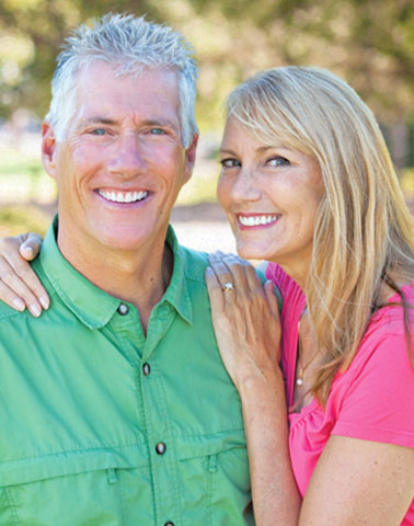 smiling couple oral surgery patients Richardson General and Cosmetic Dentistry Richardson TX